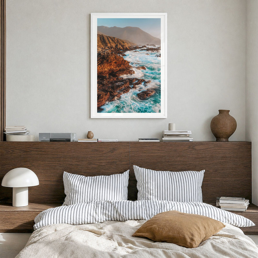 Big Sur Photo No 3 Poster in a white wood frame, hanging in a bedroom, white border
