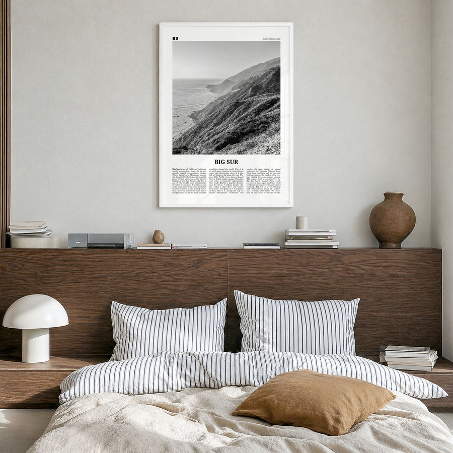 Big Sur Newspaper No 2 Poster in a white wood frame, hanging in a bedroom