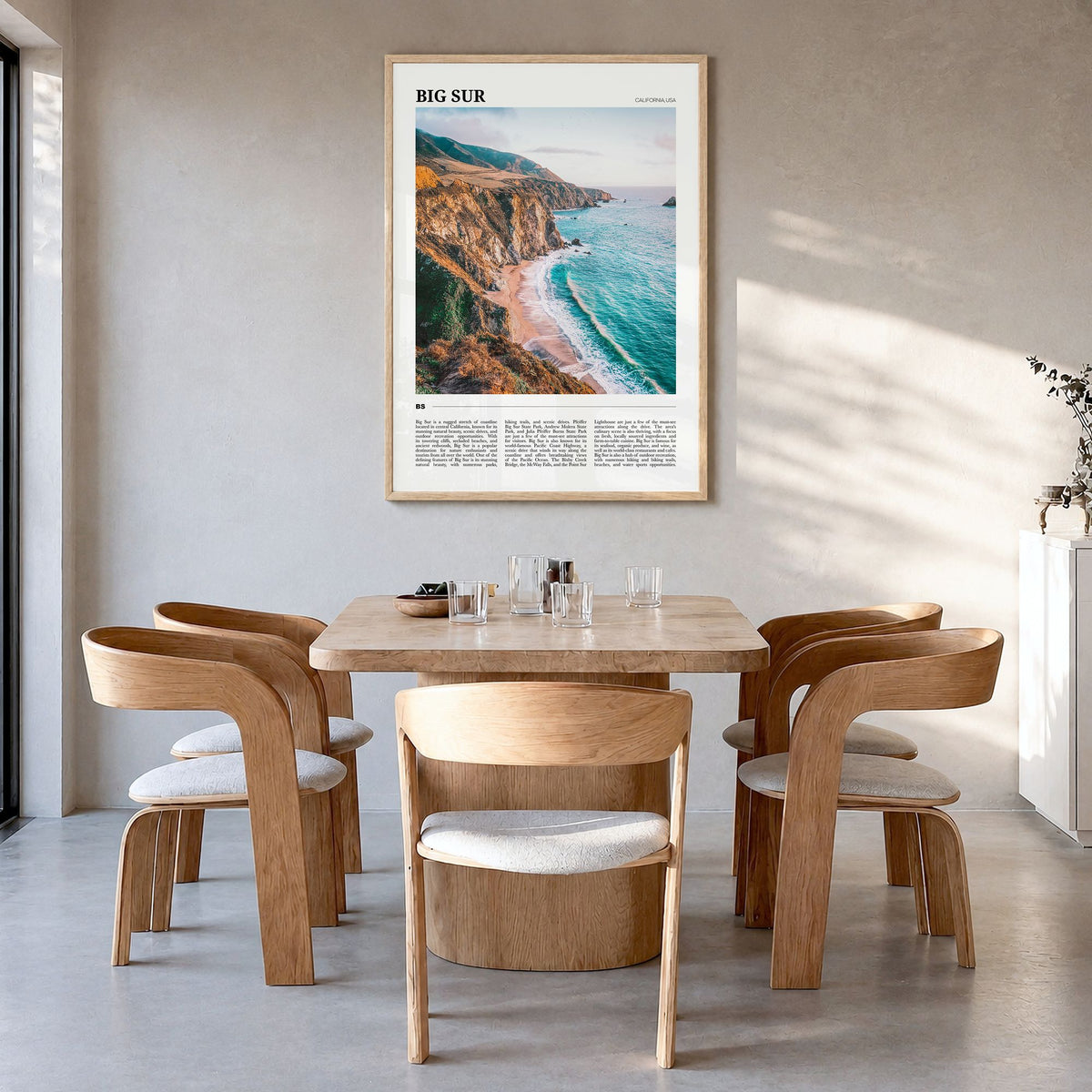 Big Sur Travel No 1 Poster in a natural wood frame, hanging in a dining room