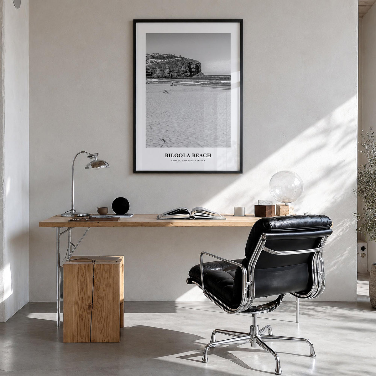 Bilgola Beach black & white classic poster of Australia – vertical wall art in black wood frame, hanging on wall