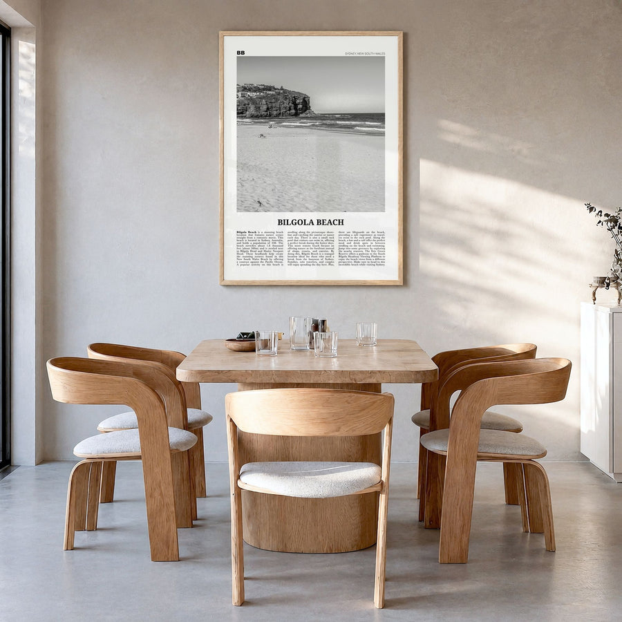 Bilgola Beach Newspaper Poster in a natural wood frame, hanging in a dining room