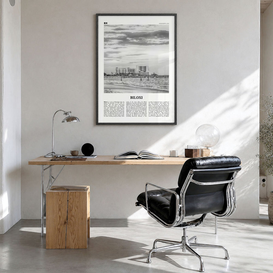 Biloxi Newspaper Poster in a black wood frame, hanging in a bright home office