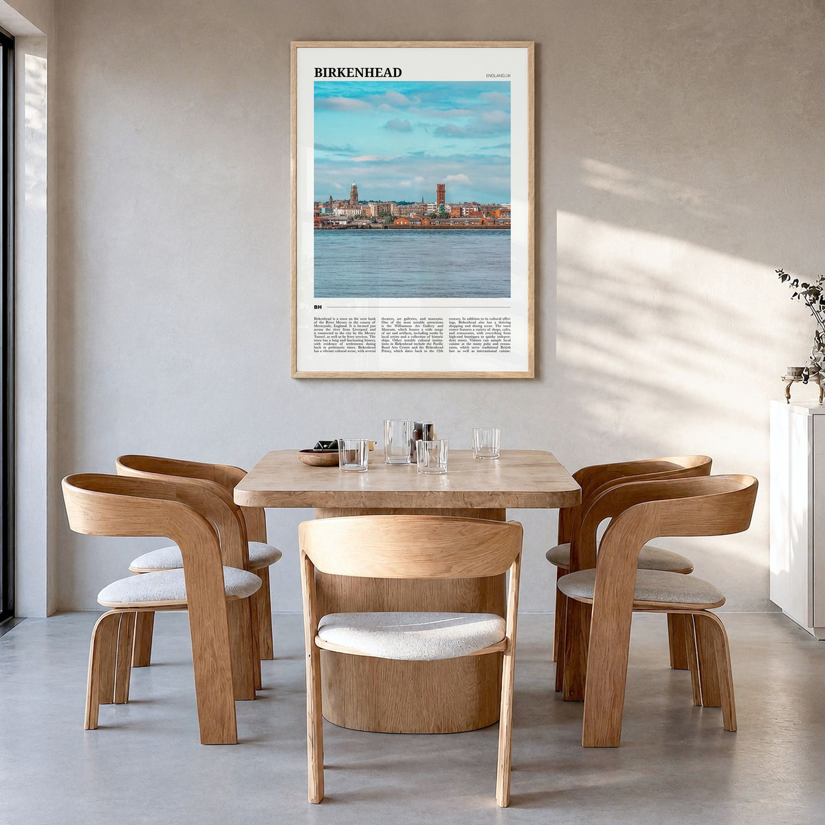 Birkenhead Travel Poster in a natural wood frame, hanging in a dining room