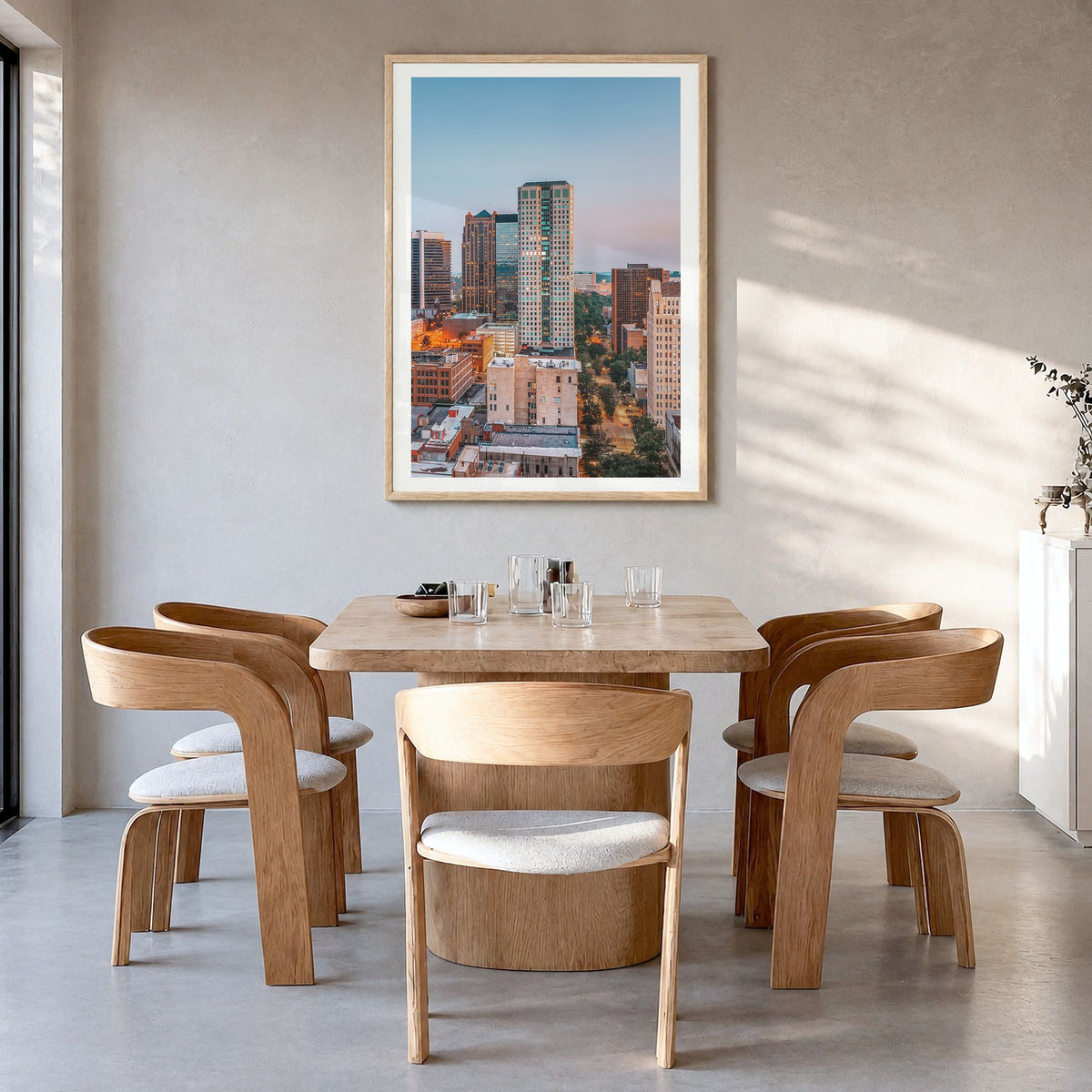 Birmingham, Alabama Photo Poster in a natural wood frame, hanging in a dining room, white border