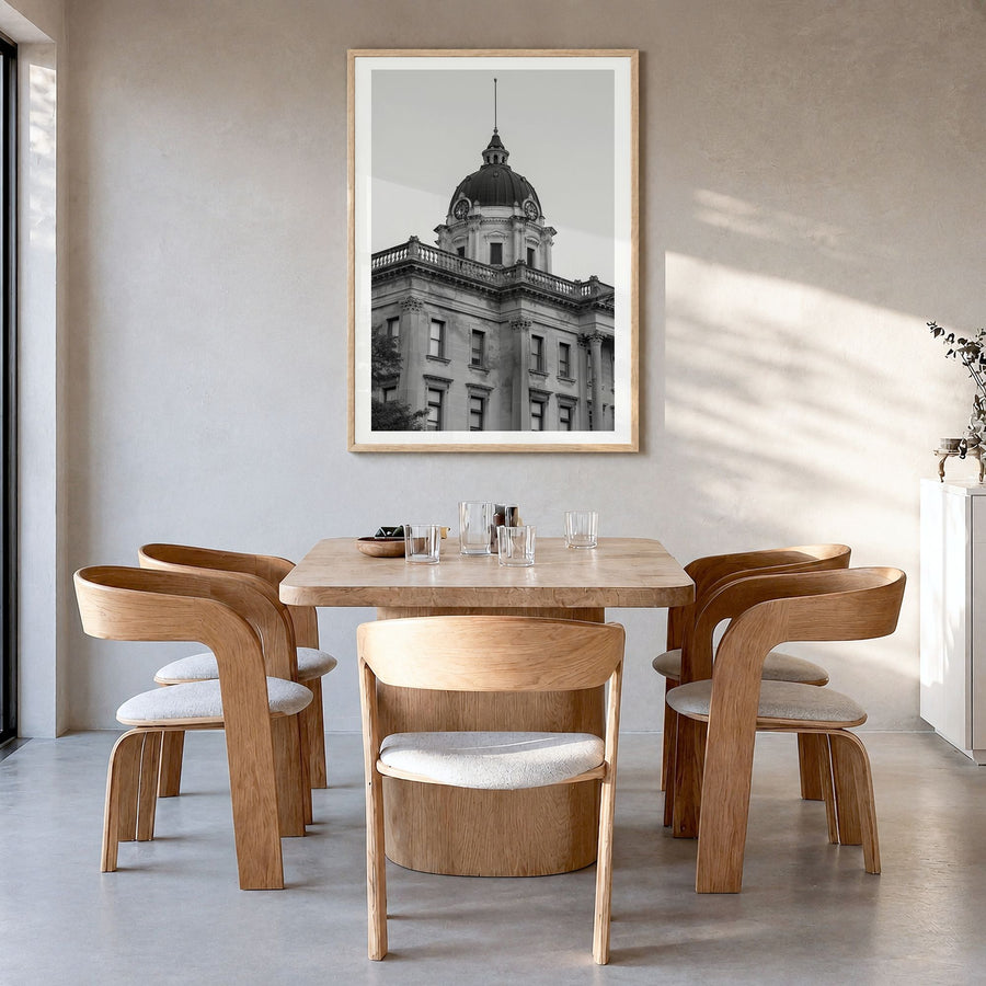 Bloomington Photo Poster in a natural wood frame, hanging in a dining room, white border