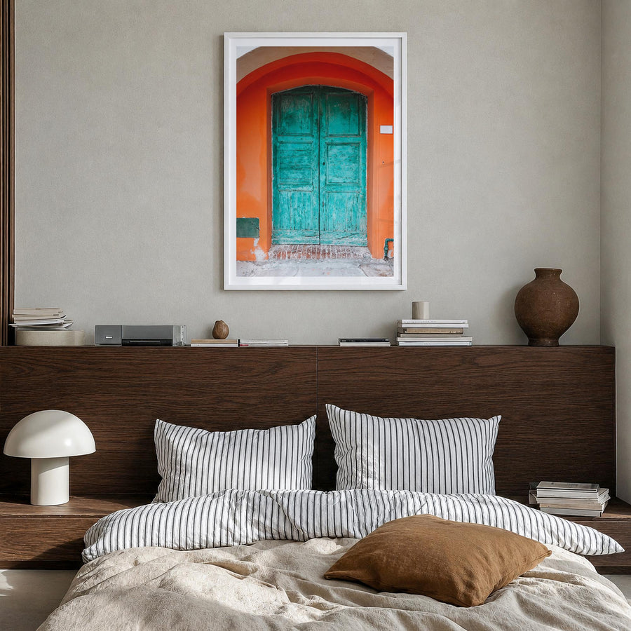 Blue Door no. 1 colorful photo poster – vertical wall art in white wood frame with white border, hanging on wall