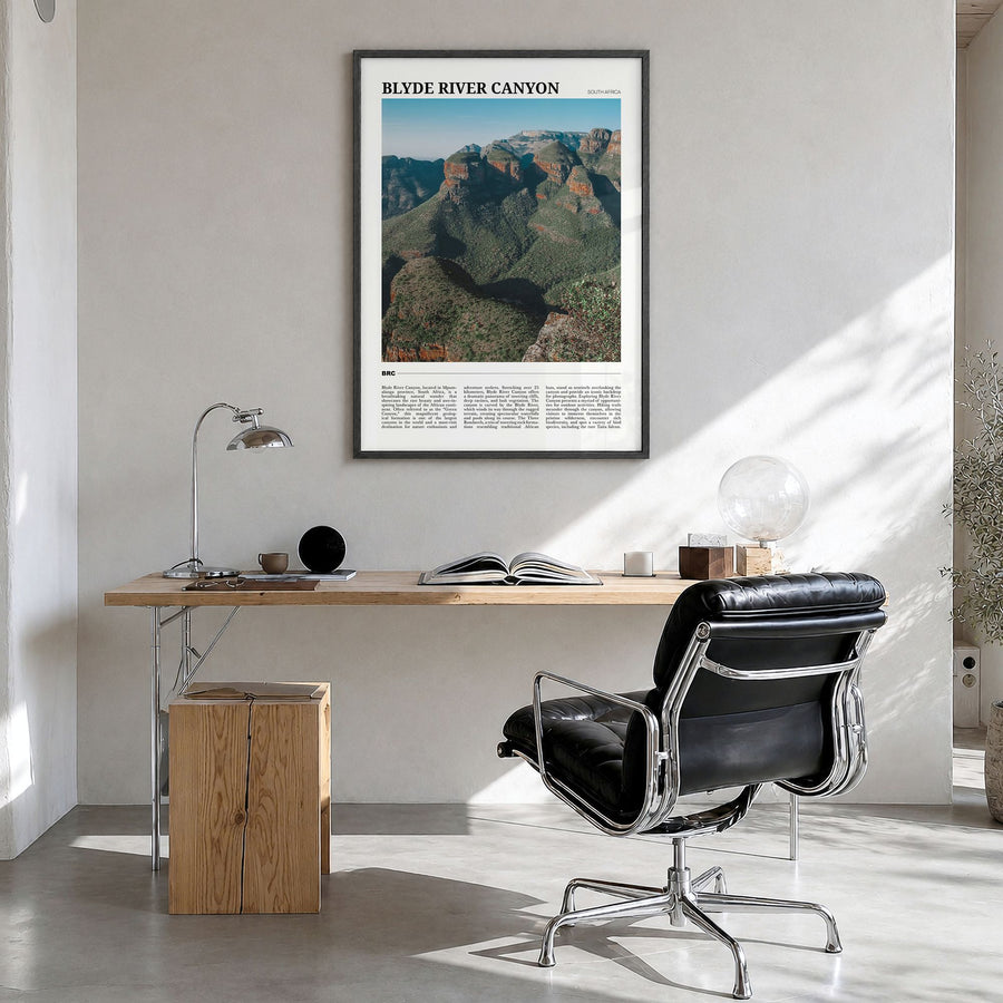 Blyde River Canyon Travel Poster in a black wood frame, hanging in a bright home office