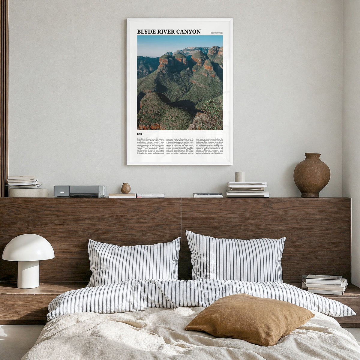 Blyde River Canyon Travel Poster in a white wood frame, hanging in a bedroom