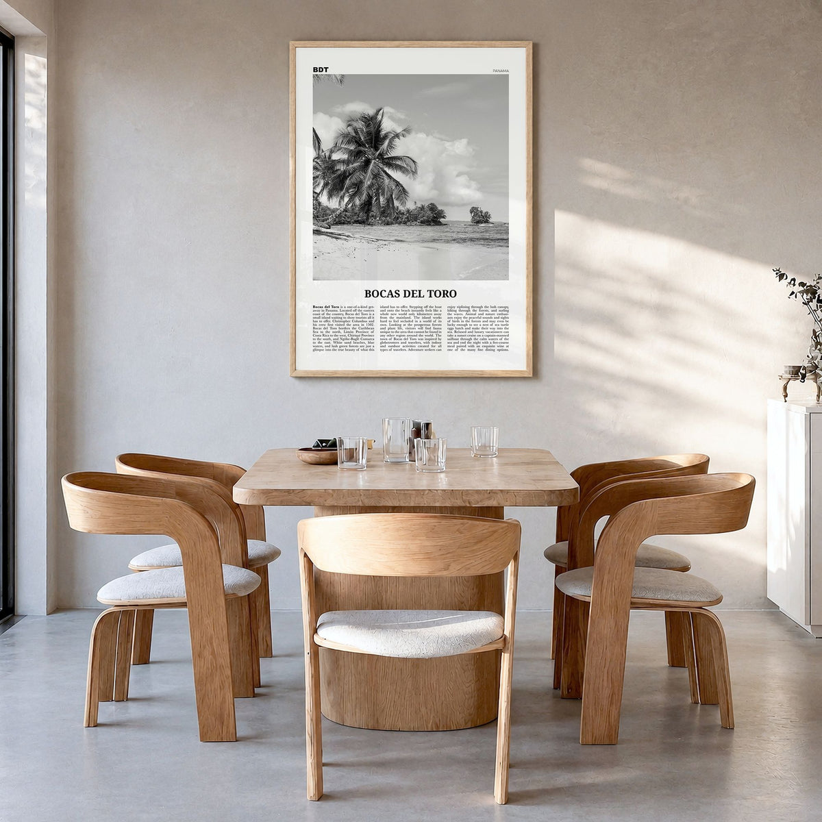 Bocas del Toro Newspaper Poster in a natural wood frame, hanging in a dining room