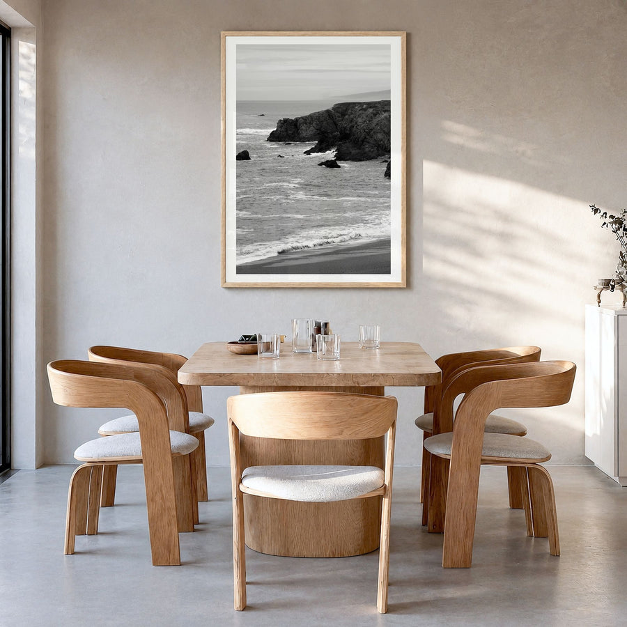 Bodega Bay Photo Poster in a natural wood frame, hanging in a dining room, white border