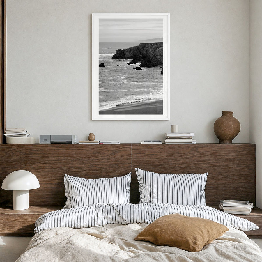 Bodega Bay Photo Poster in a white wood frame, hanging in a bedroom, white border