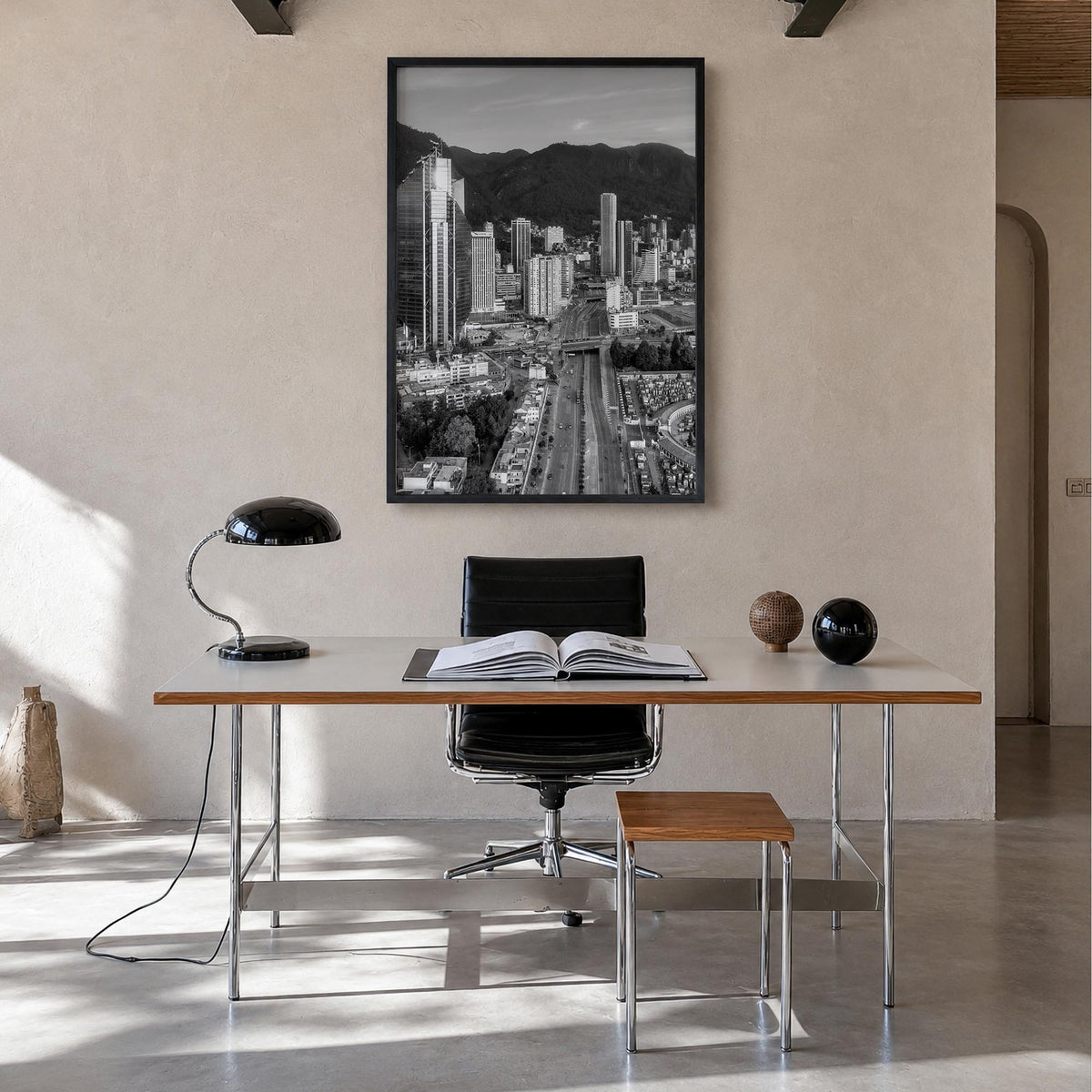 Bogotá black & white photo poster of Colombia – vertical wall art in black wood frame, hanging on wall