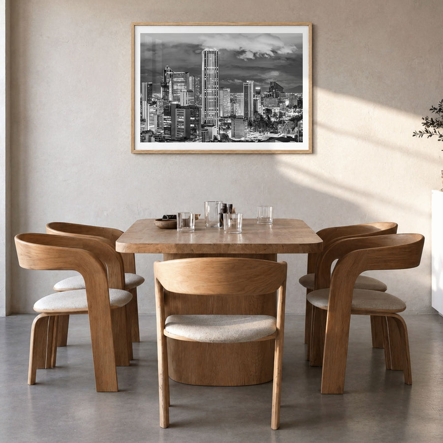 Bogotá Photo No 2 Poster in a natural wood frame, hanging in a dining room, white border