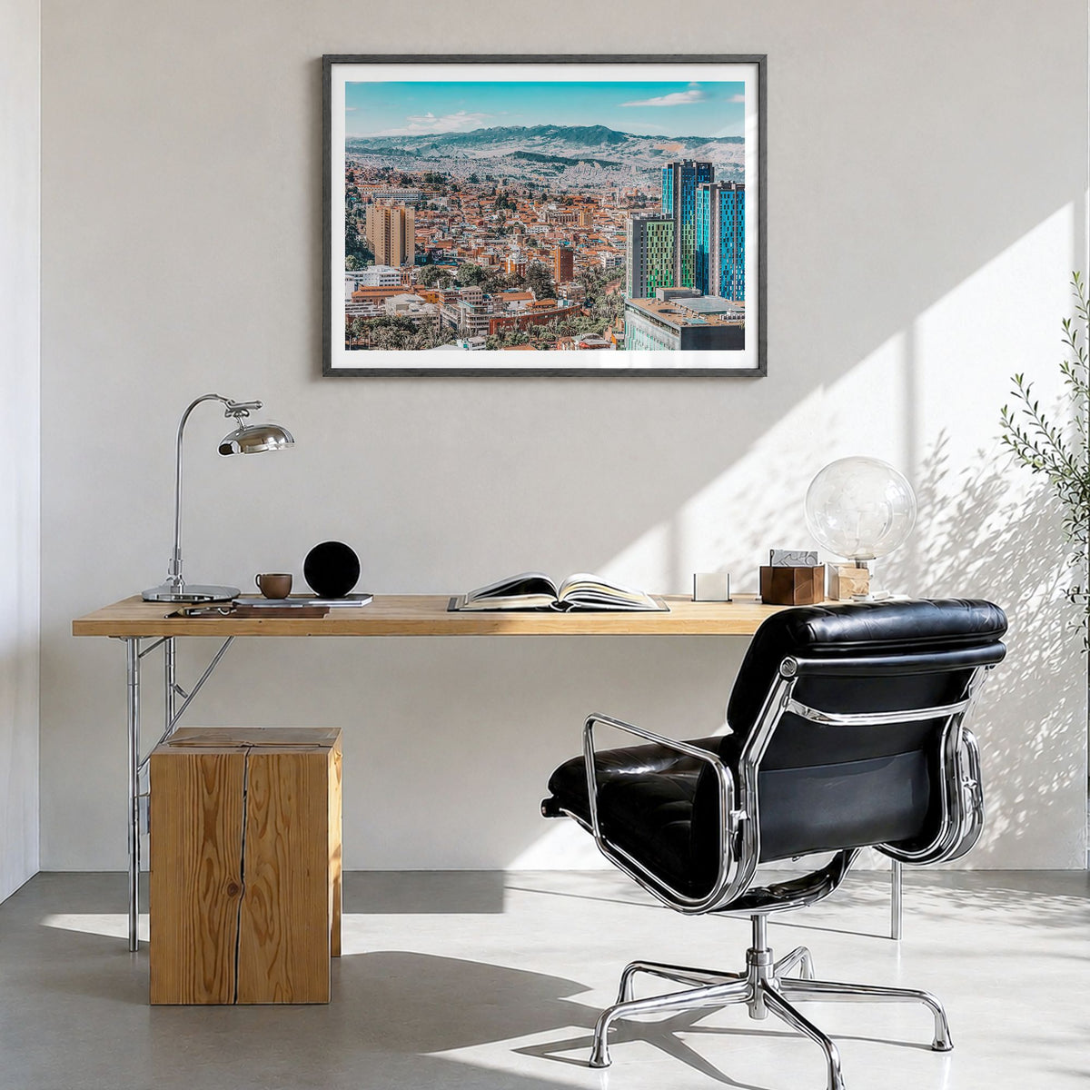 Bogotá Photo No 1 Poster in a black wood frame, hanging in a bright home office, white border