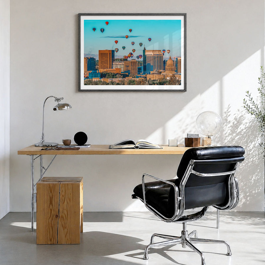 Boise Photo Poster in a black wood frame, hanging in a bright home office, white border