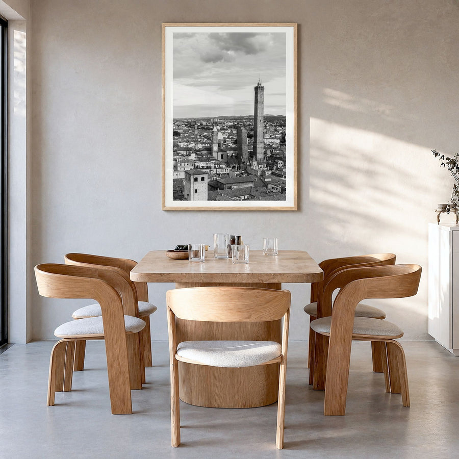 Bologna Photo Poster in a natural wood frame, hanging in a dining room, white border