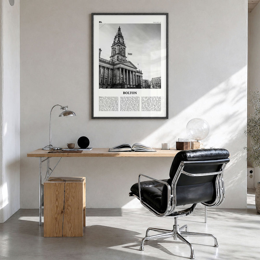 Bolton Newspaper Poster in a black wood frame, hanging in a bright home office