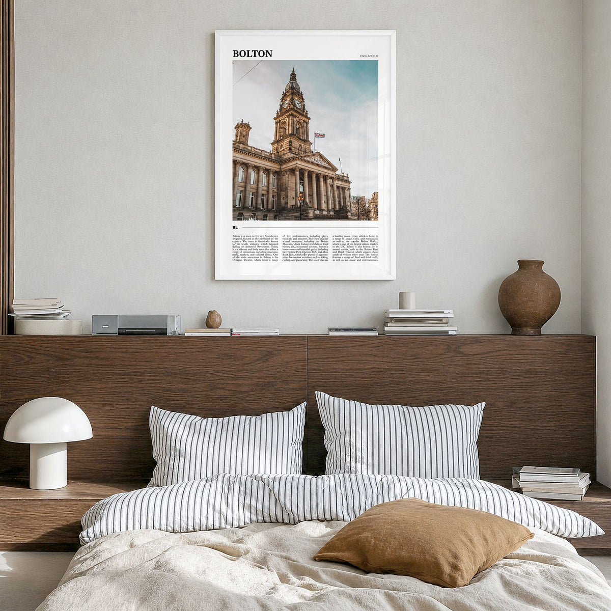 Bolton Travel Poster in a white wood frame, hanging in a bedroom