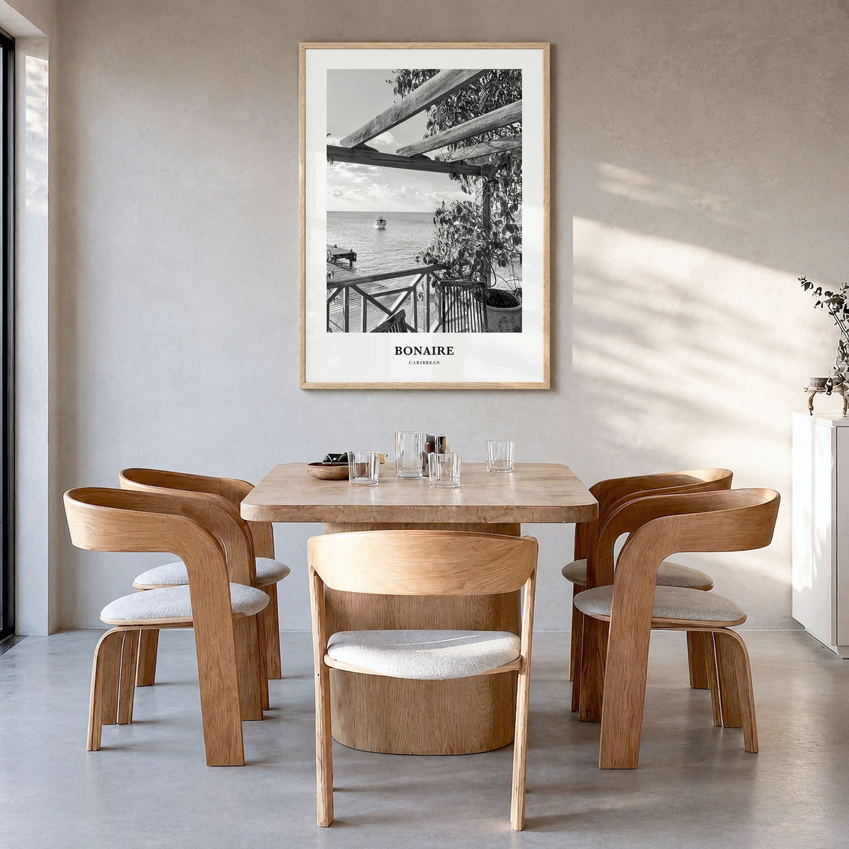 Bonaire Classic Poster in a natural wood frame, hanging in a dining room