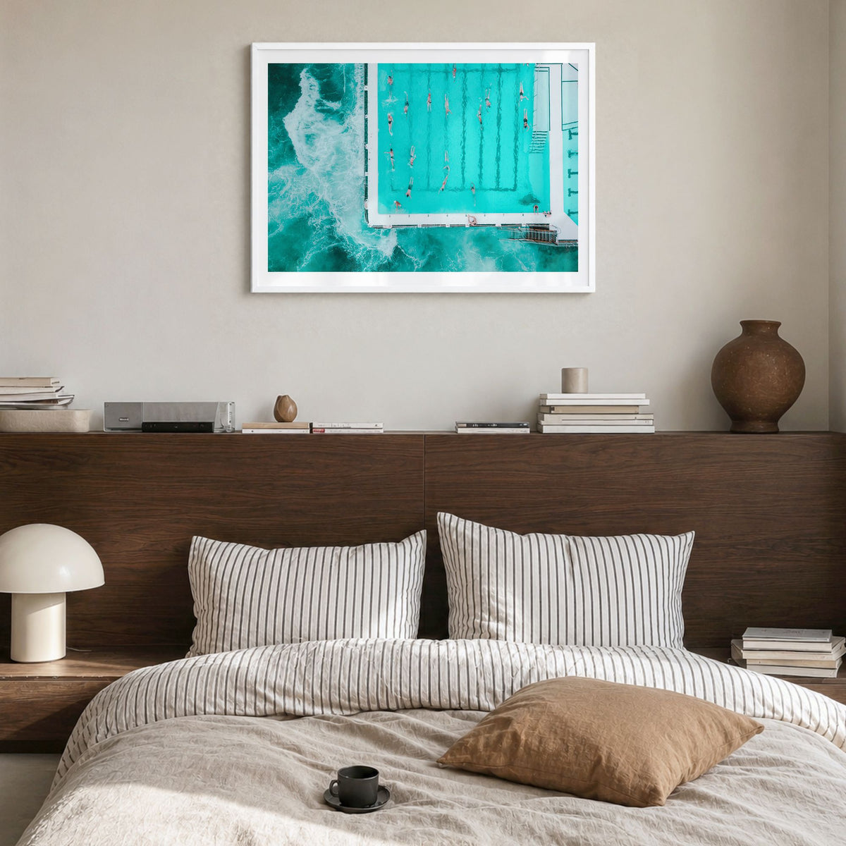 Bondi Beach Photo Poster in a white wood frame, hanging in a bedroom, white border