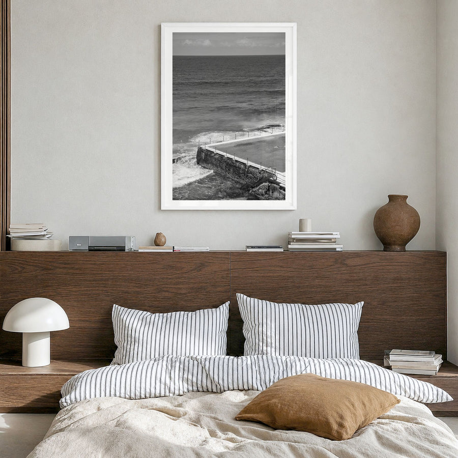 Bondi Beach Photo No 1 Poster in a white wood frame, hanging in a bedroom, white border