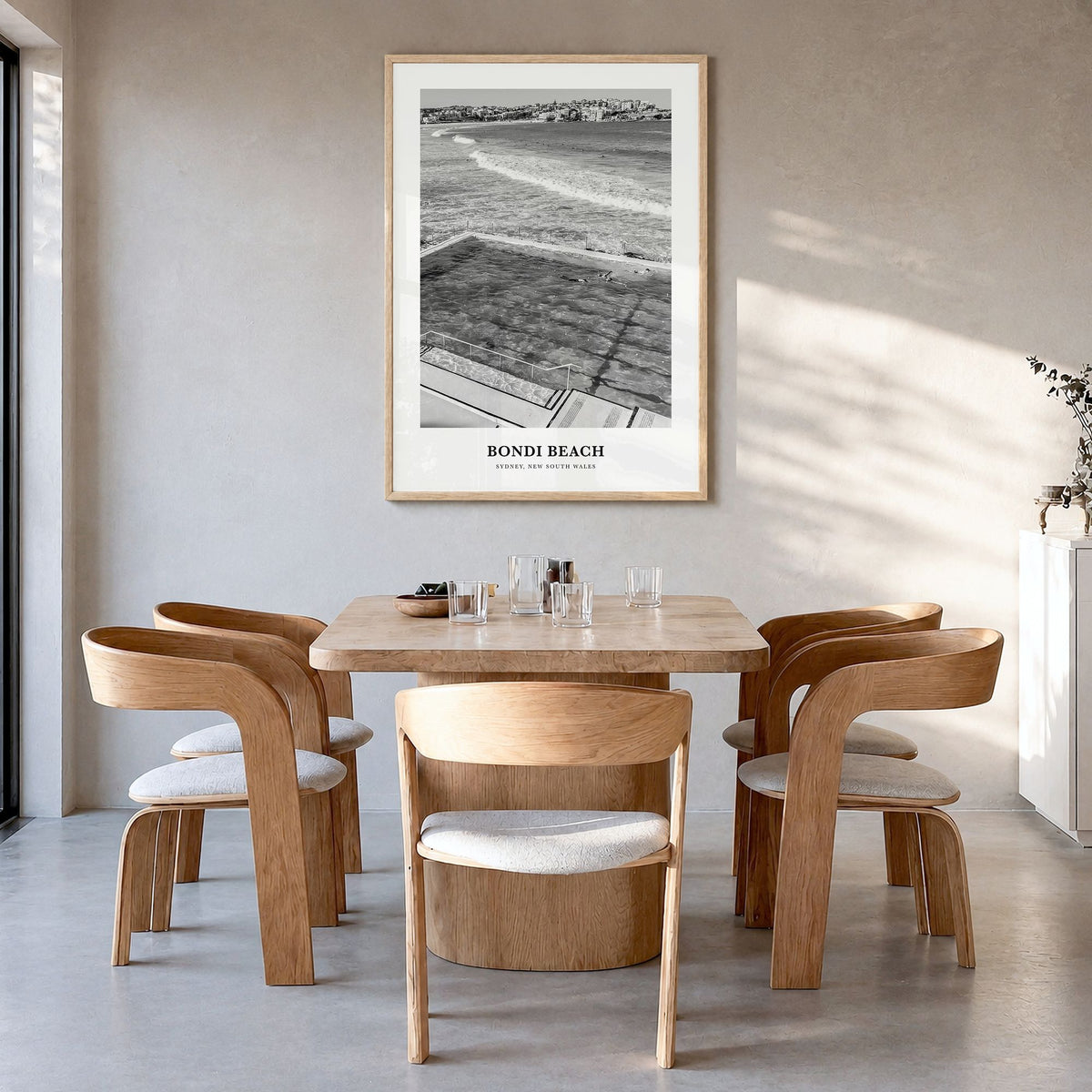 Bondi Beach Classic No 1 Poster in a natural wood frame, hanging in a dining room