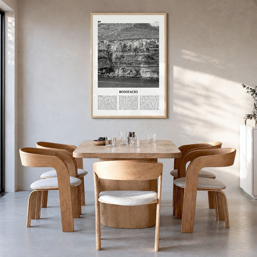 Bonifacio Newspaper Poster in a natural wood frame, hanging in a dining room