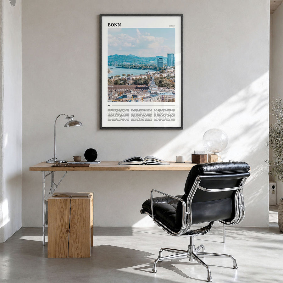 Bonn Travel Poster in a black wood frame, hanging in a bright home office