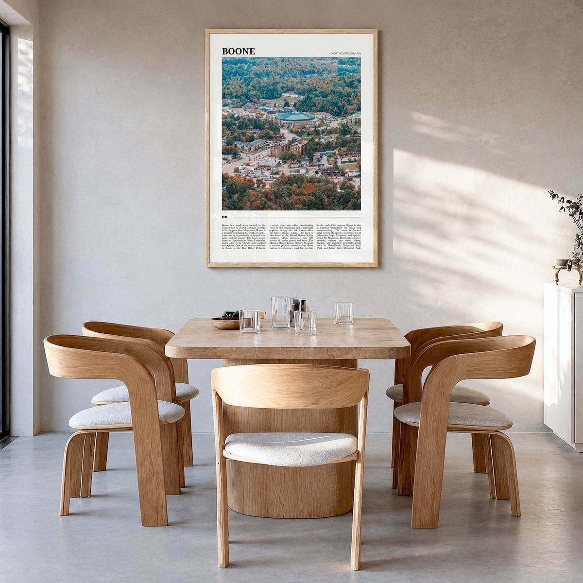 Boone Travel Poster in a natural wood frame, hanging in a dining room