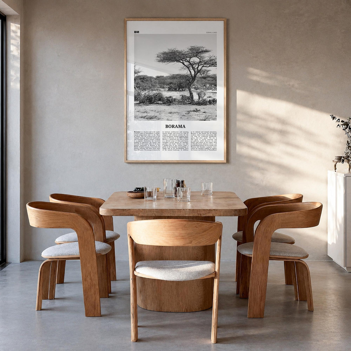Borama black & white newspaper poster of Somalia – vertical wall art in natural wood frame, hanging on wall