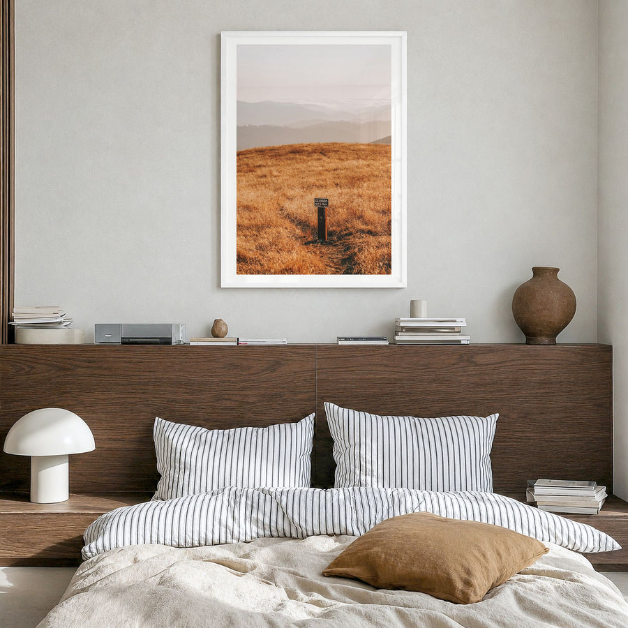 Borel Hill Photo Poster in a white wood frame, hanging in a bedroom, white border