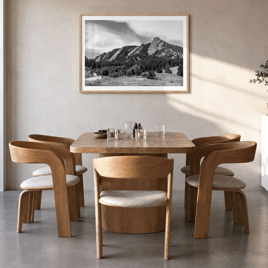 Boulder Photo Poster in a natural wood frame, hanging in a dining room, white border