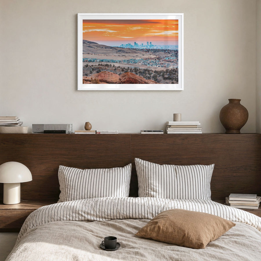 Boulder Photo Poster in a white wood frame, hanging in a bedroom, white border