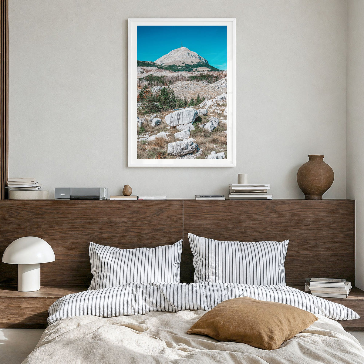 Boulder Photo No 2 Poster in a white wood frame, hanging in a bedroom, white border