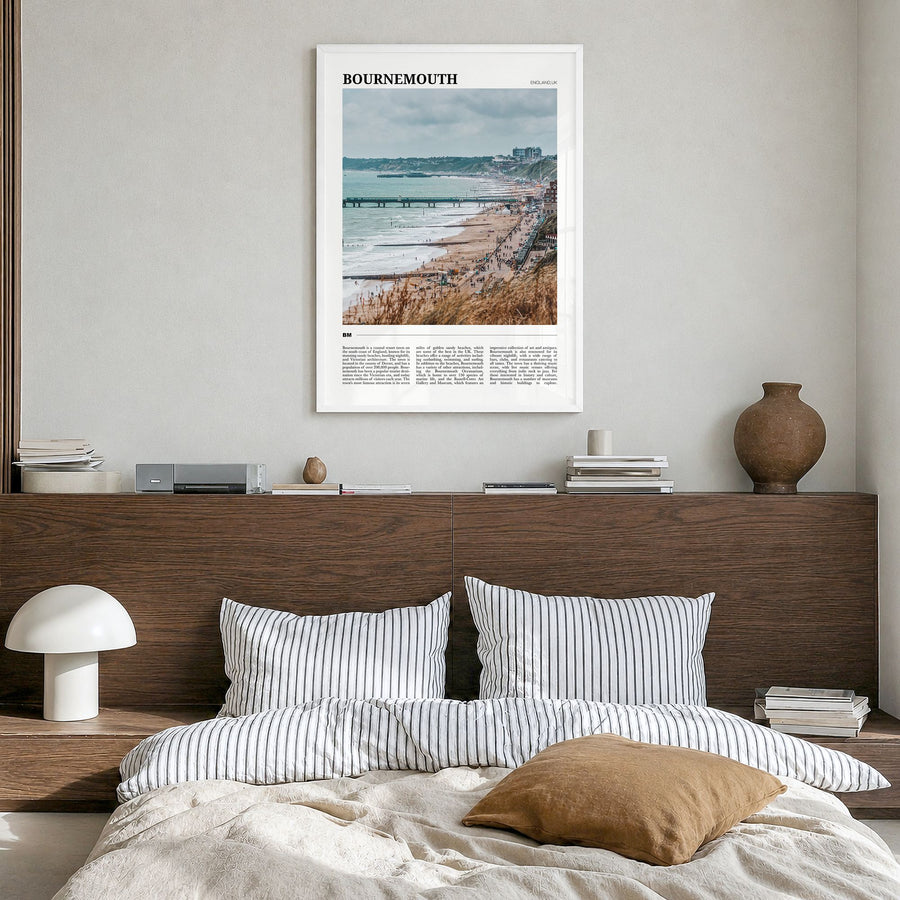Bournemouth Travel Poster in a white wood frame, hanging in a bedroom