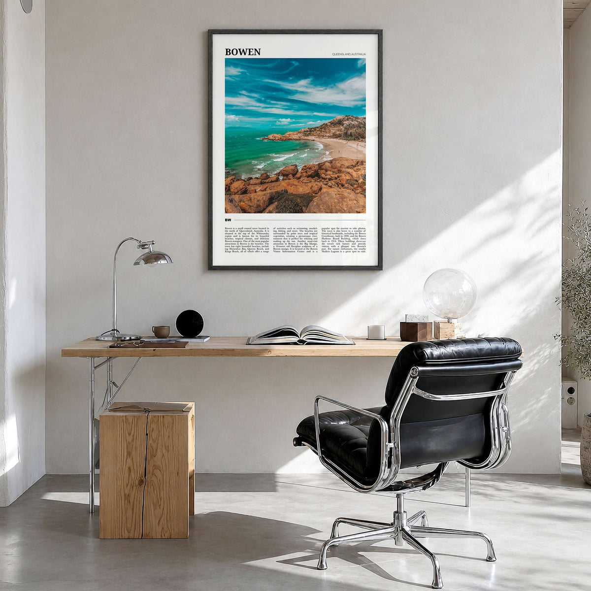 Bowen Travel Poster in a black wood frame, hanging in a bright home office