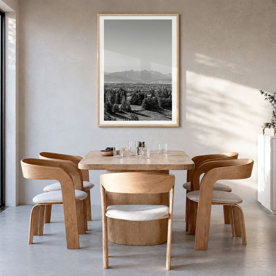 Bozeman Photo Poster in a natural wood frame, hanging in a dining room, white border