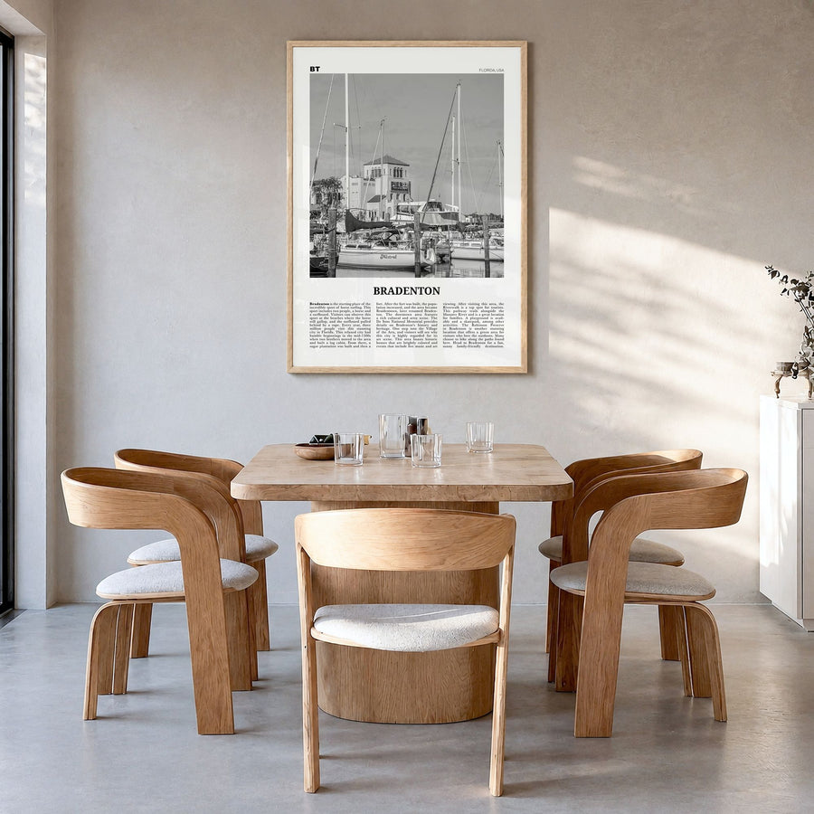 Bradenton Newspaper Poster in a natural wood frame, hanging in a dining room