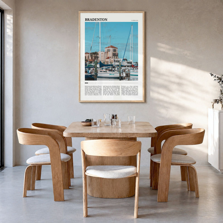 Bradenton Travel Poster in a natural wood frame, hanging in a dining room