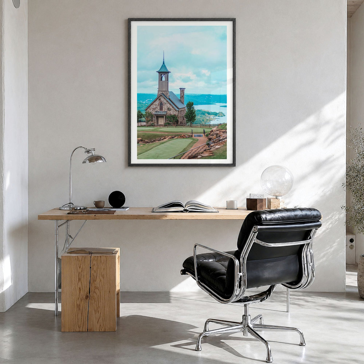 Branson Photo Poster in a black wood frame, hanging in a bright home office, white border