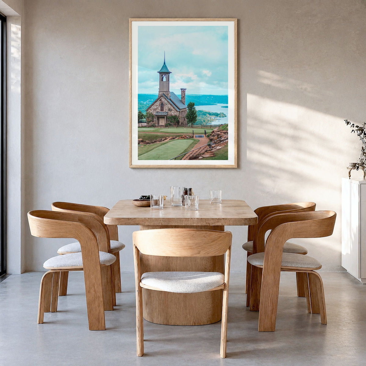 Branson Photo Poster in a natural wood frame, hanging in a dining room, white border