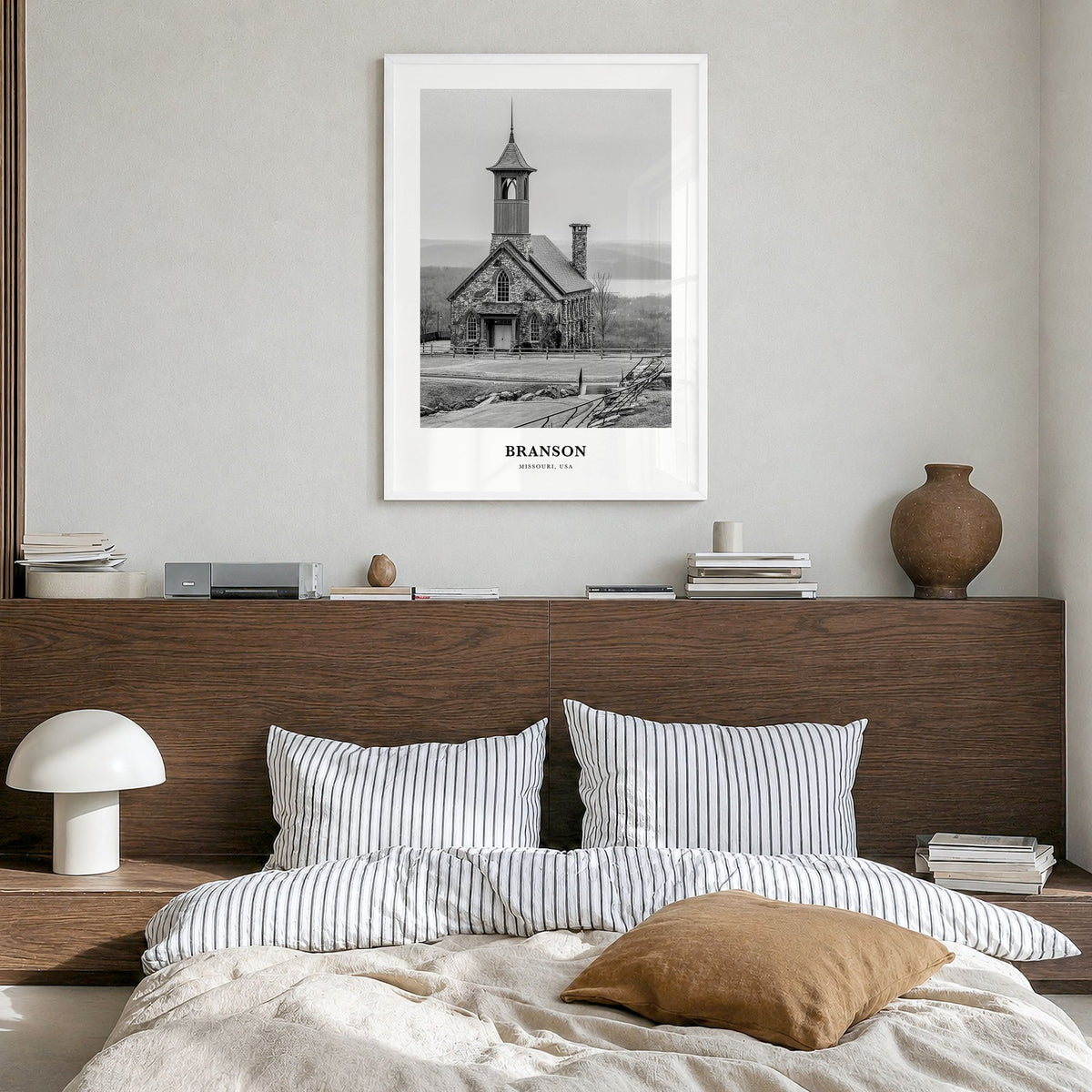 Branson Classic Poster in a white wood frame, hanging in a bedroom