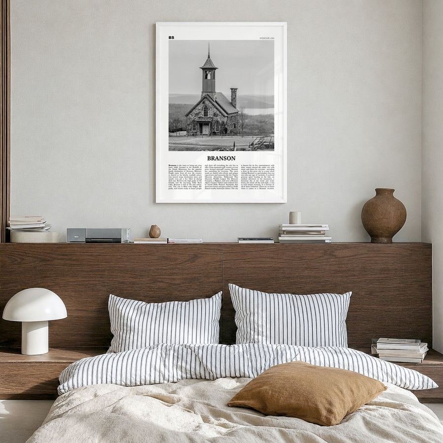 Branson Newspaper Poster in a white wood frame, hanging in a bedroom