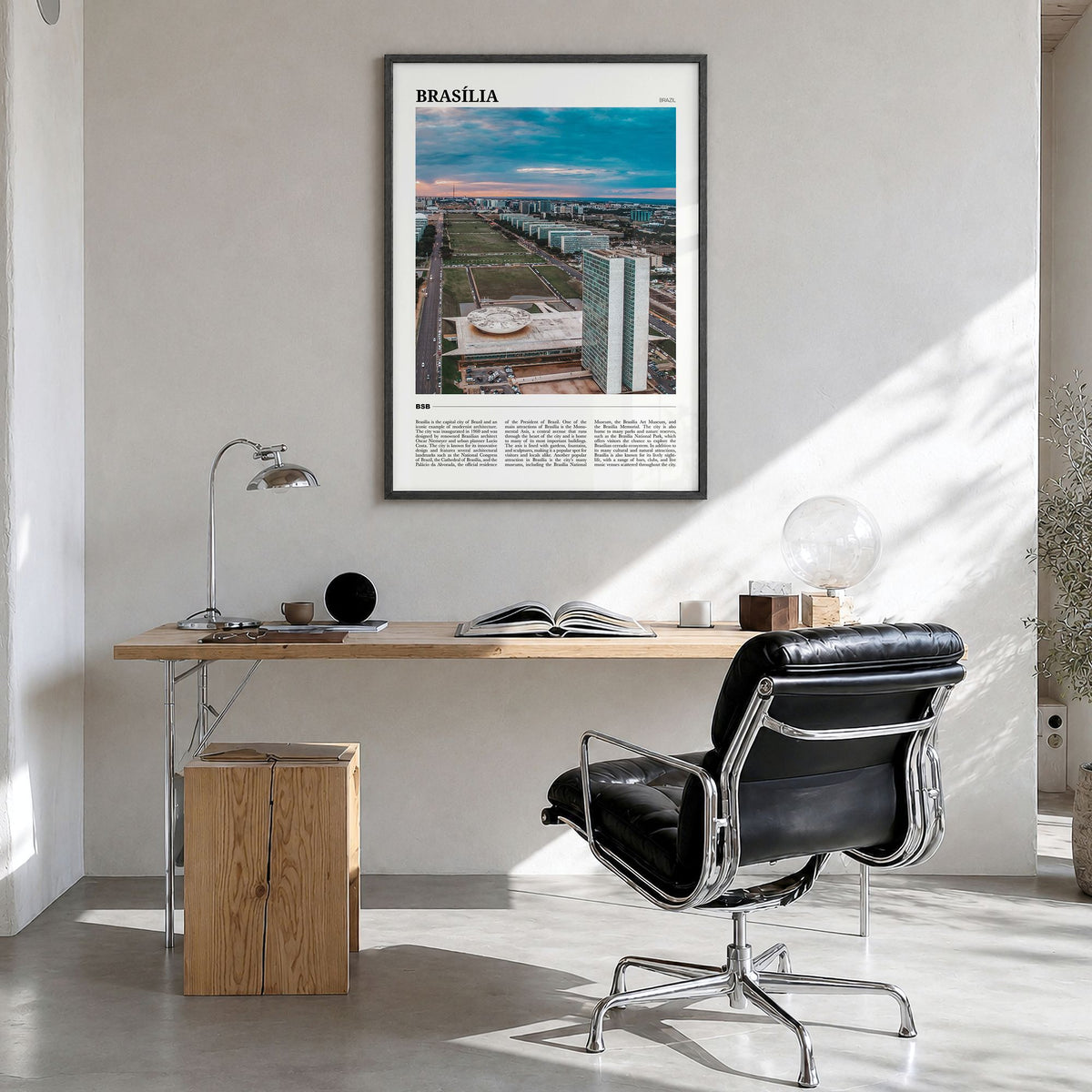 Brasília Travel Poster in a black wood frame, hanging in a bright home office
