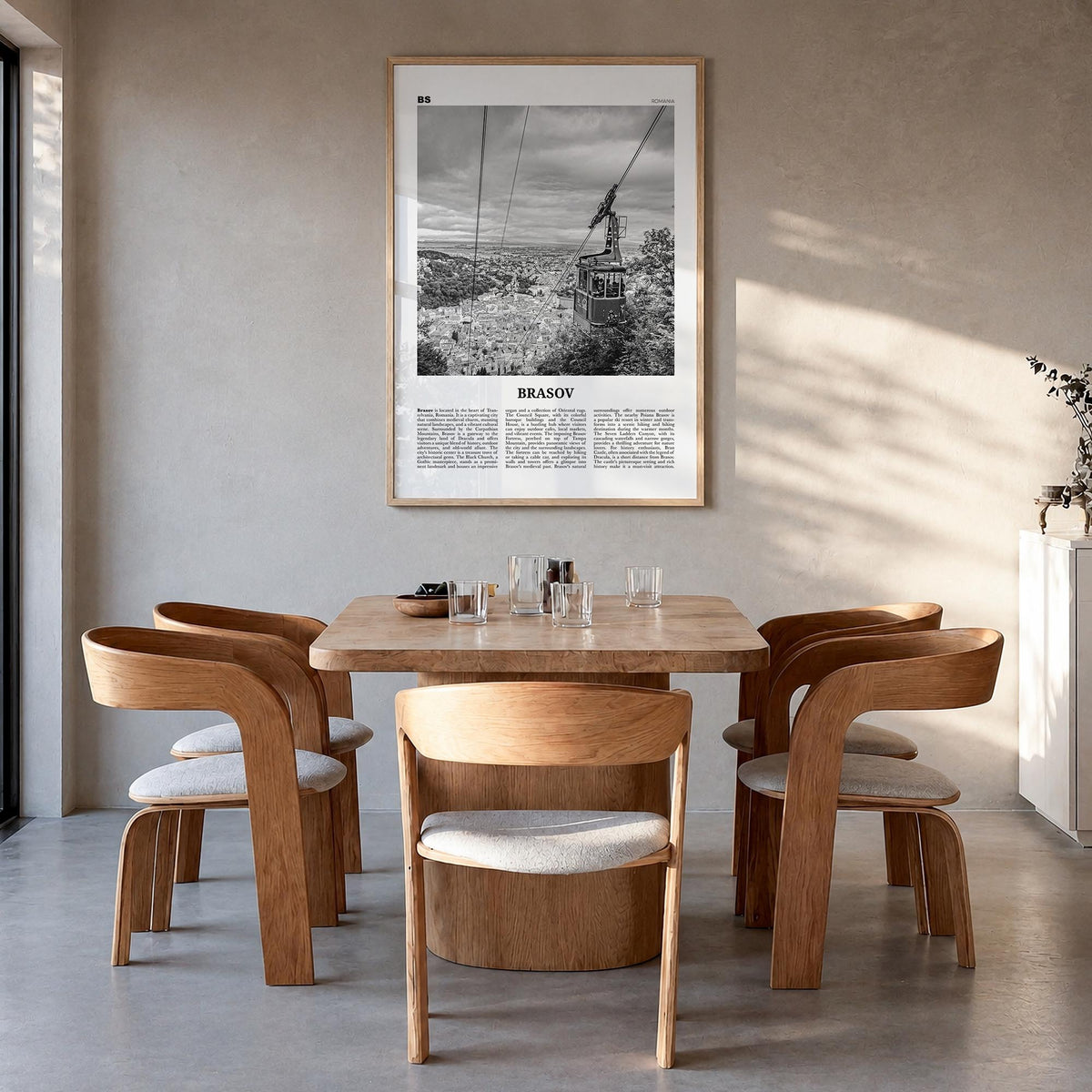 Brașov black & white newspaper poster of Romania – vertical wall art in natural wood frame, hanging on wall