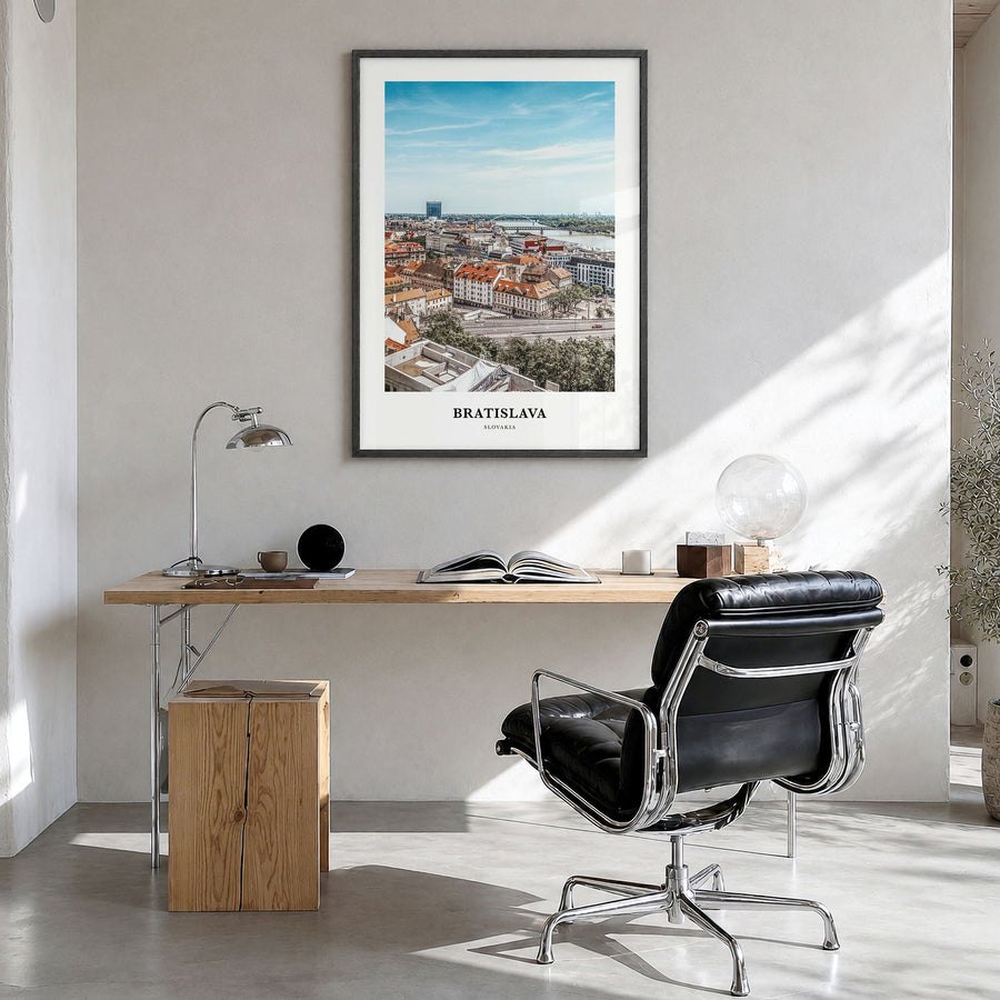 Bratislava Classic Poster in a black wood frame, hanging in a bright home office