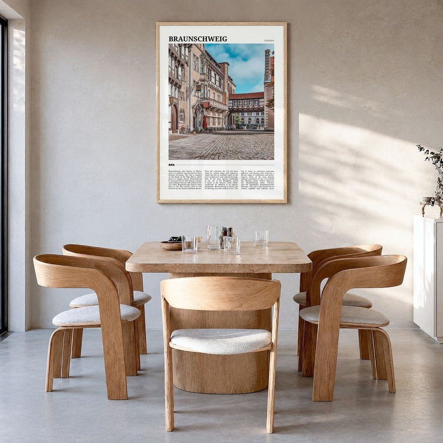 Braunschweig Travel Poster in a natural wood frame, hanging in a dining room