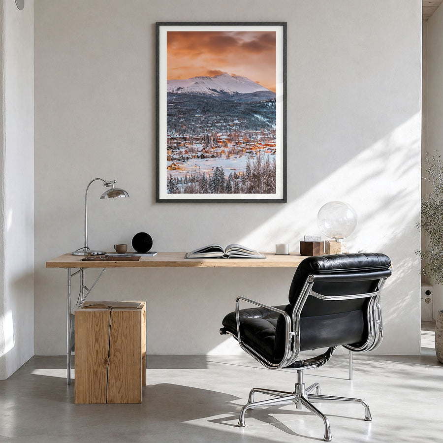 Breckenridge Photo Poster in a black wood frame, hanging in a bright home office, white border