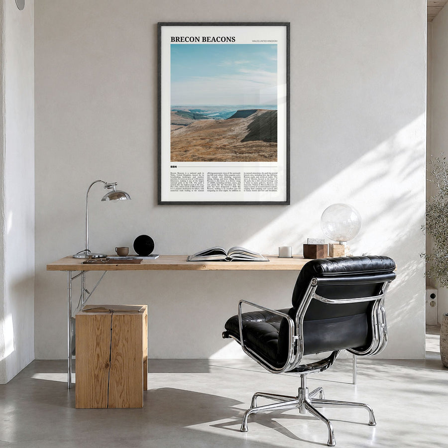 Brecon Beacons Travel Poster in a black wood frame, hanging in a bright home office