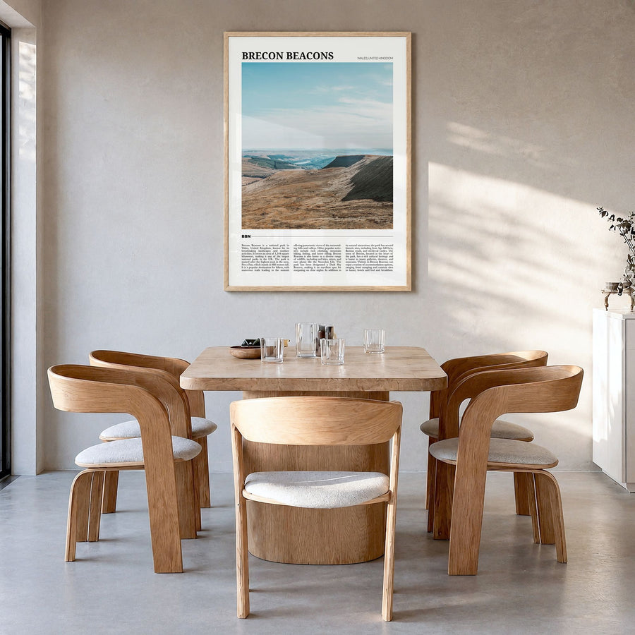 Brecon Beacons Travel Poster in a natural wood frame, hanging in a dining room